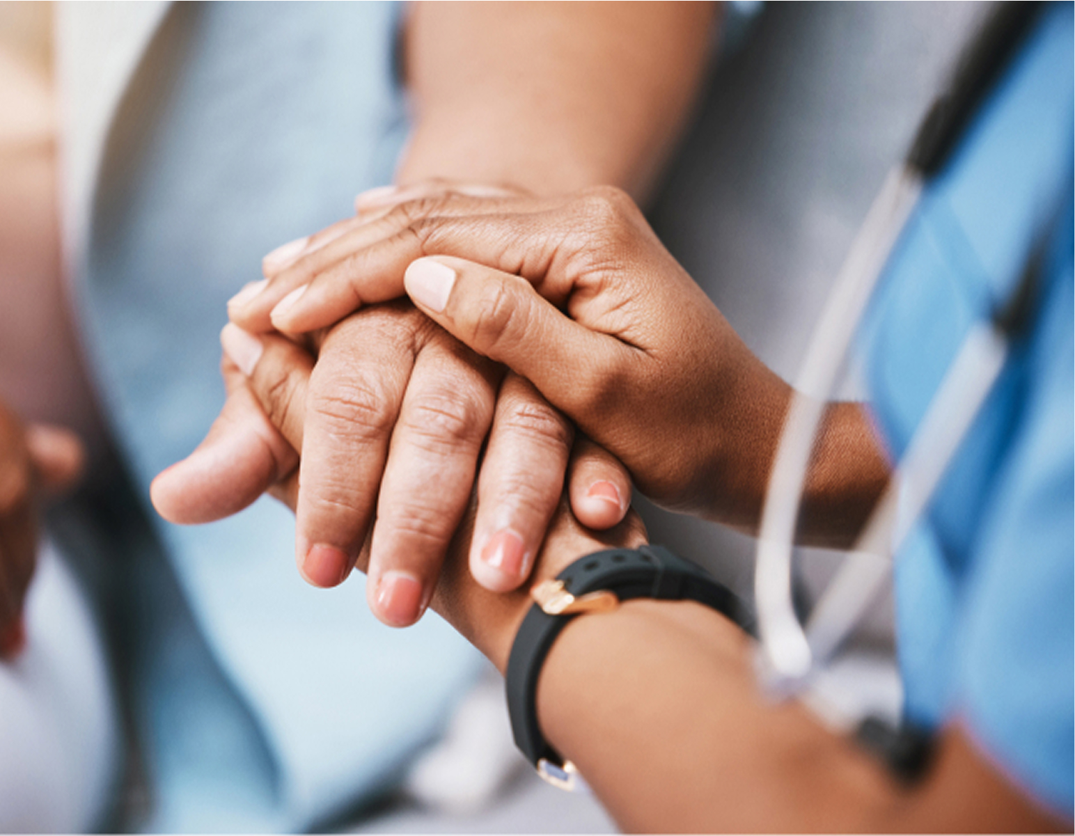 A healthcare professional, wearing a stethoscope and smartwatch, gently holding an elderly person's hand, conveying care and compassion in a medical setting.